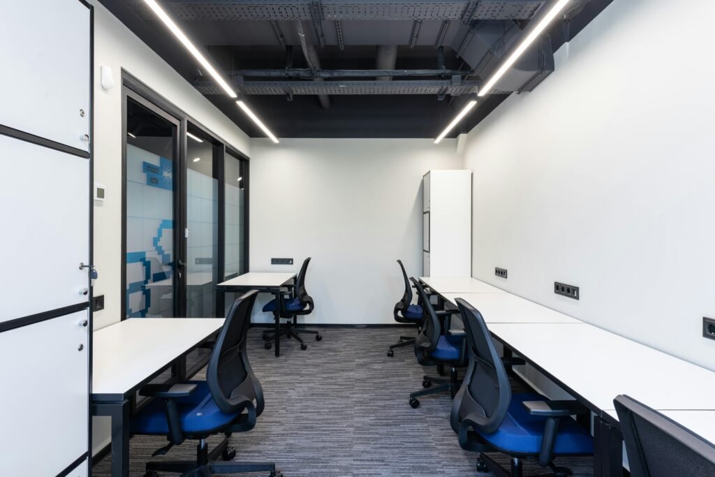 Clean and contemporary office workspace with modern furniture and minimalist decor.